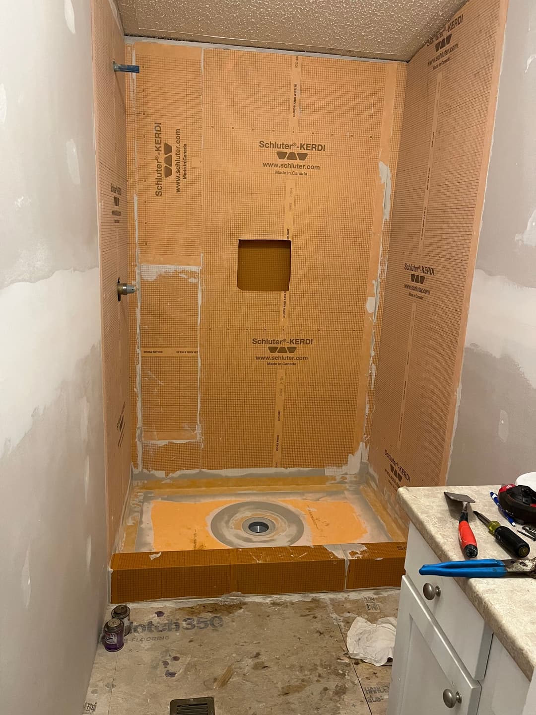 Shower renovation with Schluter-KERDI shower system ready for tiling and plumbing installation.